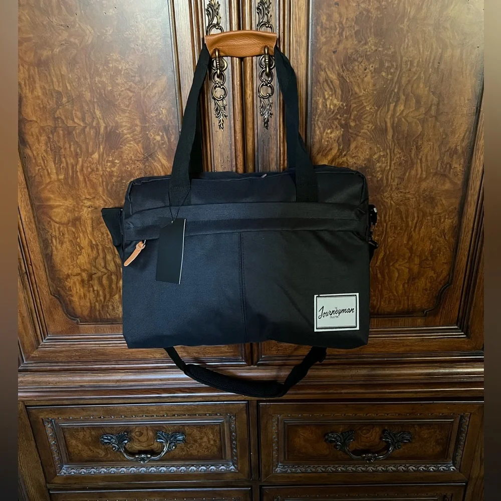 NWT The Journeyman Bag Co Duffle Bag in black with red mesh interior.